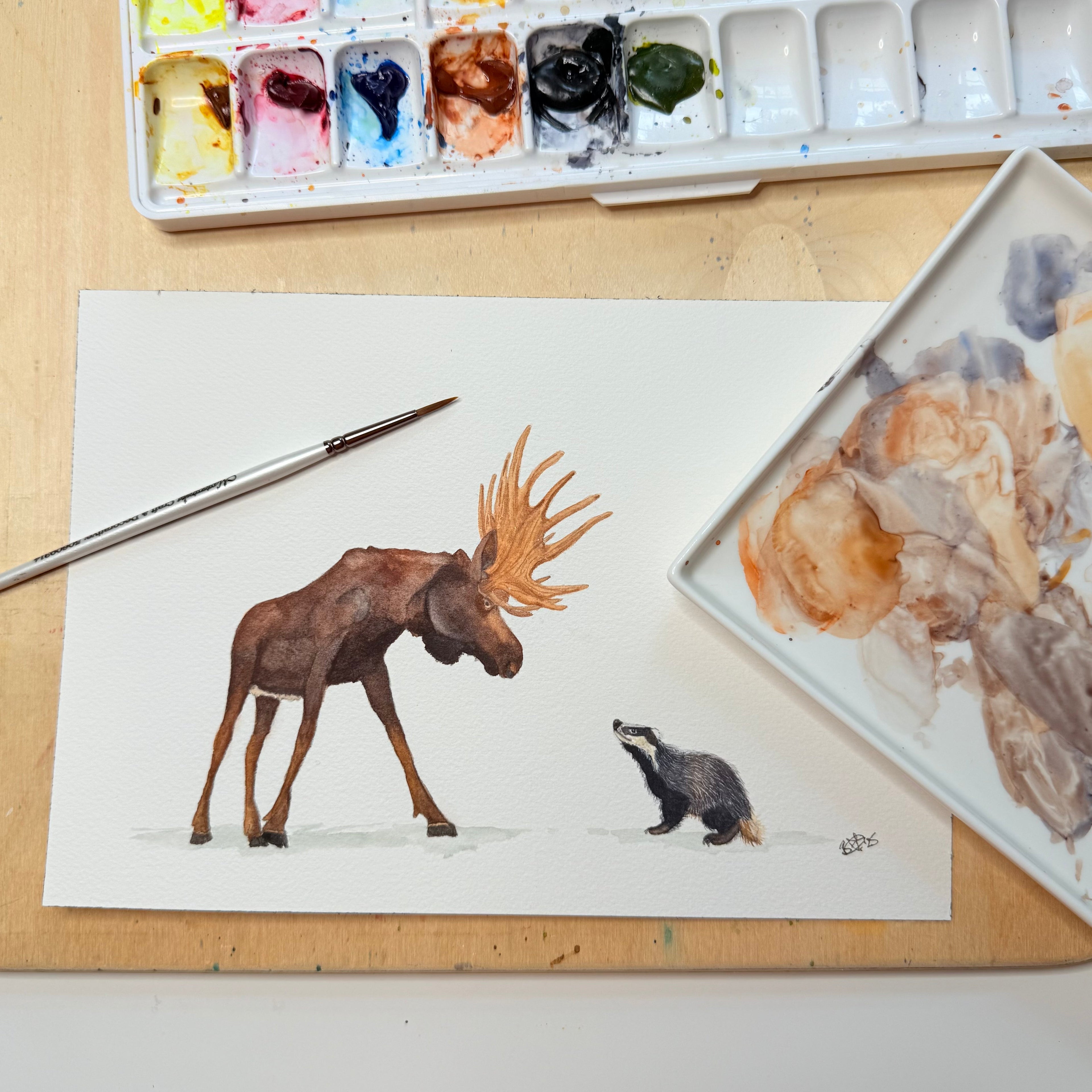 Two watercolour sketch options for a bespoke moose and badger birthday card commission by Bozena Allison Studio