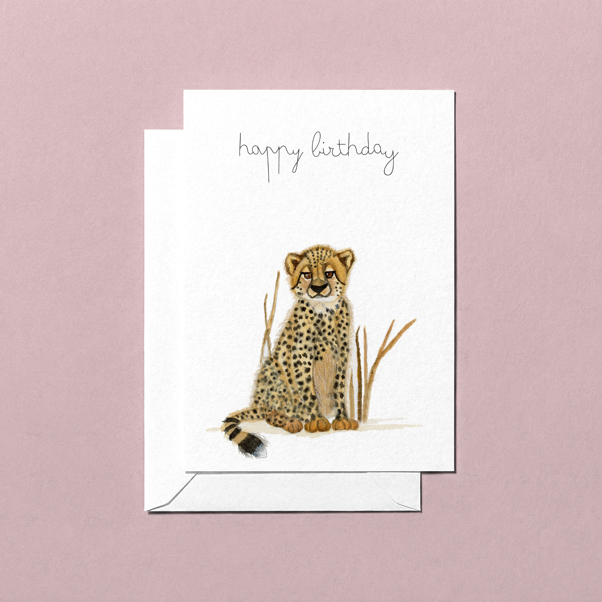 Greeting card with a baby cheetah a watercolour illustration and 'happy birthday' text on a pink background