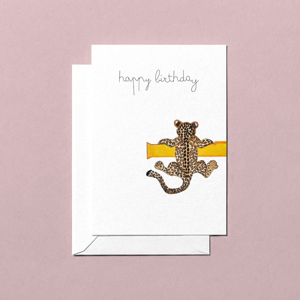 Birthday card with a leopard design and 'happy birthday' text on a pink background