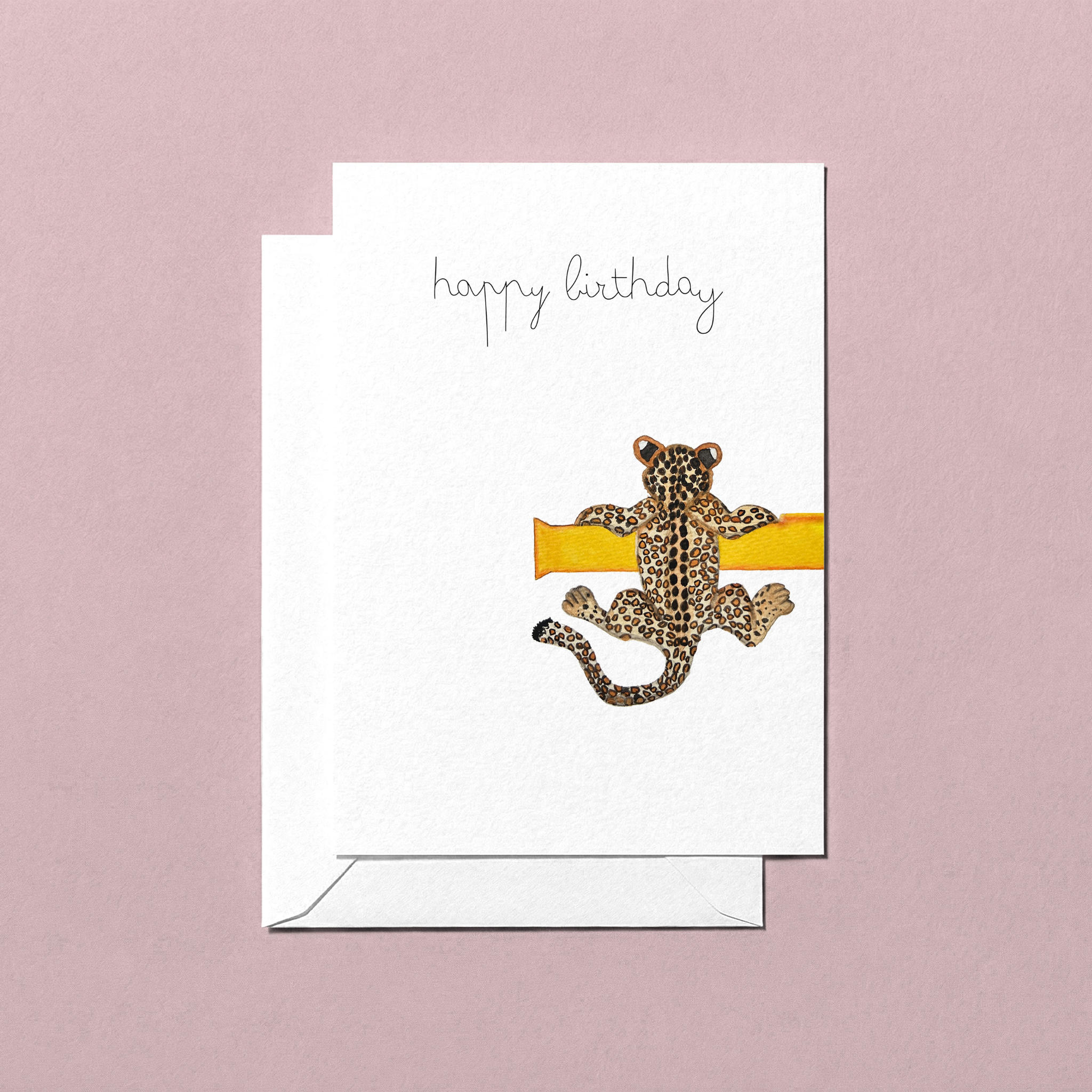 Birthday card with a leopard design and 'happy birthday' text on a pink background