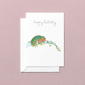 Greeting card with a colorful chameleon illustration and 'happy birthday' text