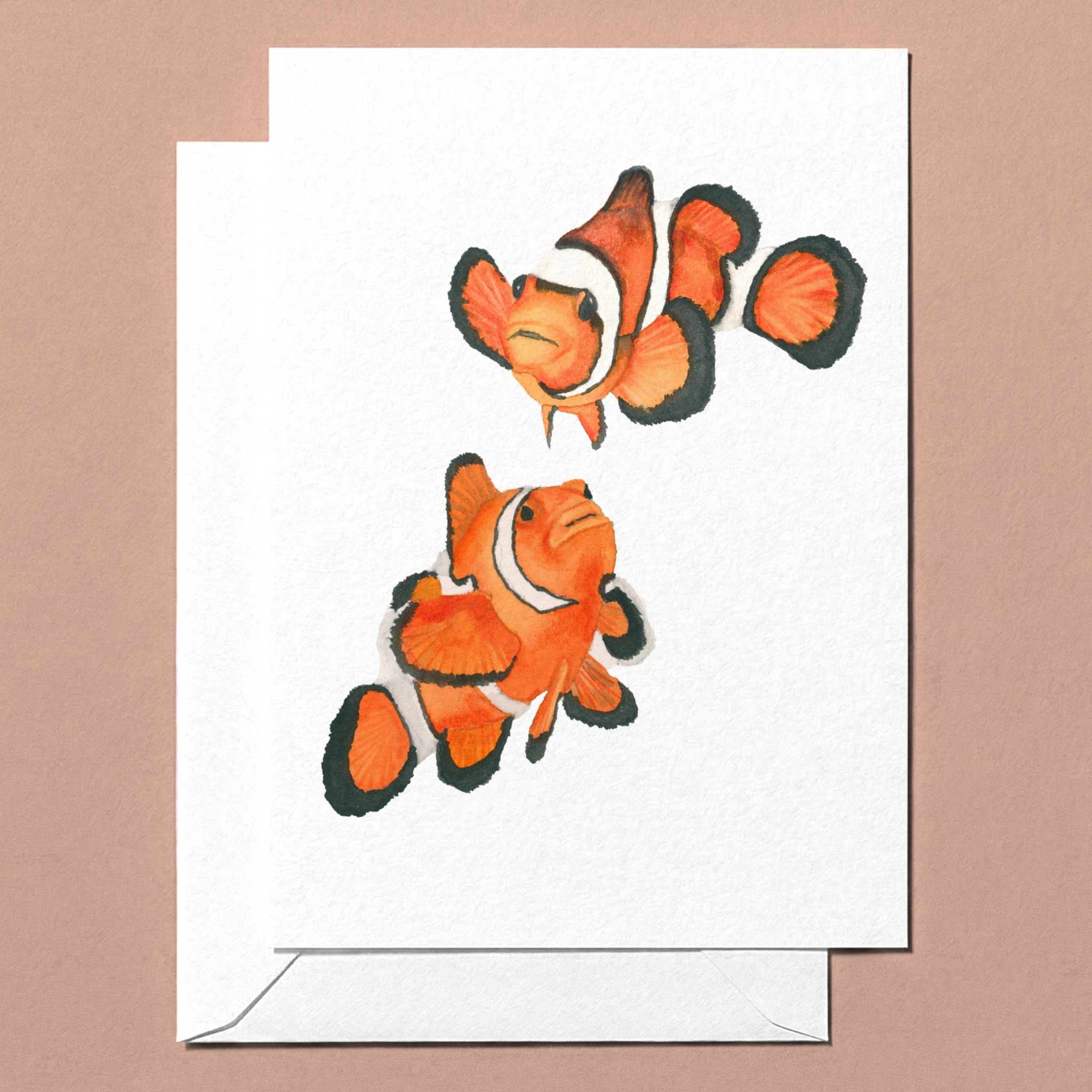 Greeting card with two watercolour clownfish on a white background