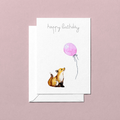 Greeting card with a foxl looking up at a pink balloon and 'happy birthday' text on a pink background