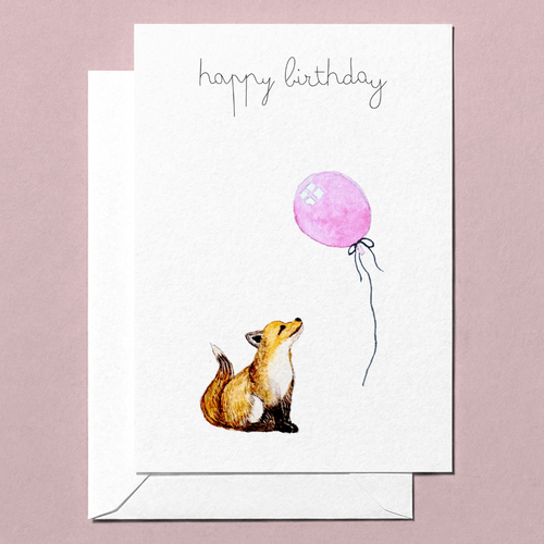 Greeting card with a foxl looking up at a pink balloon and 'happy birthday' text on a pink background
