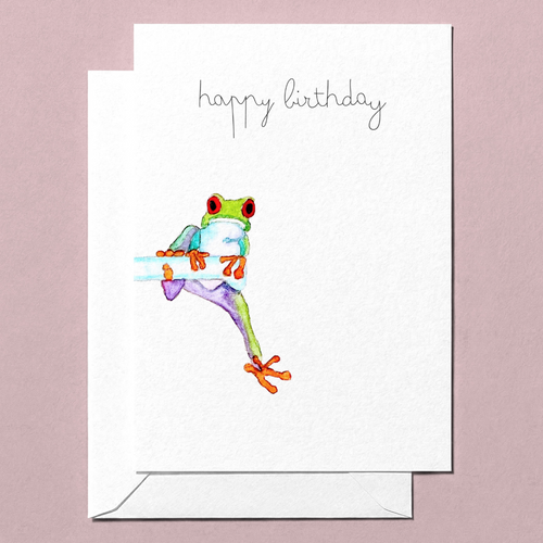 Greeting card with a hand-illustrated watercolour colorful frog illustration and 'happy birthday' text on a pink background