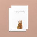 Greeting card with a ginger cat illustration and 'Happy Birthday' text on a beige background