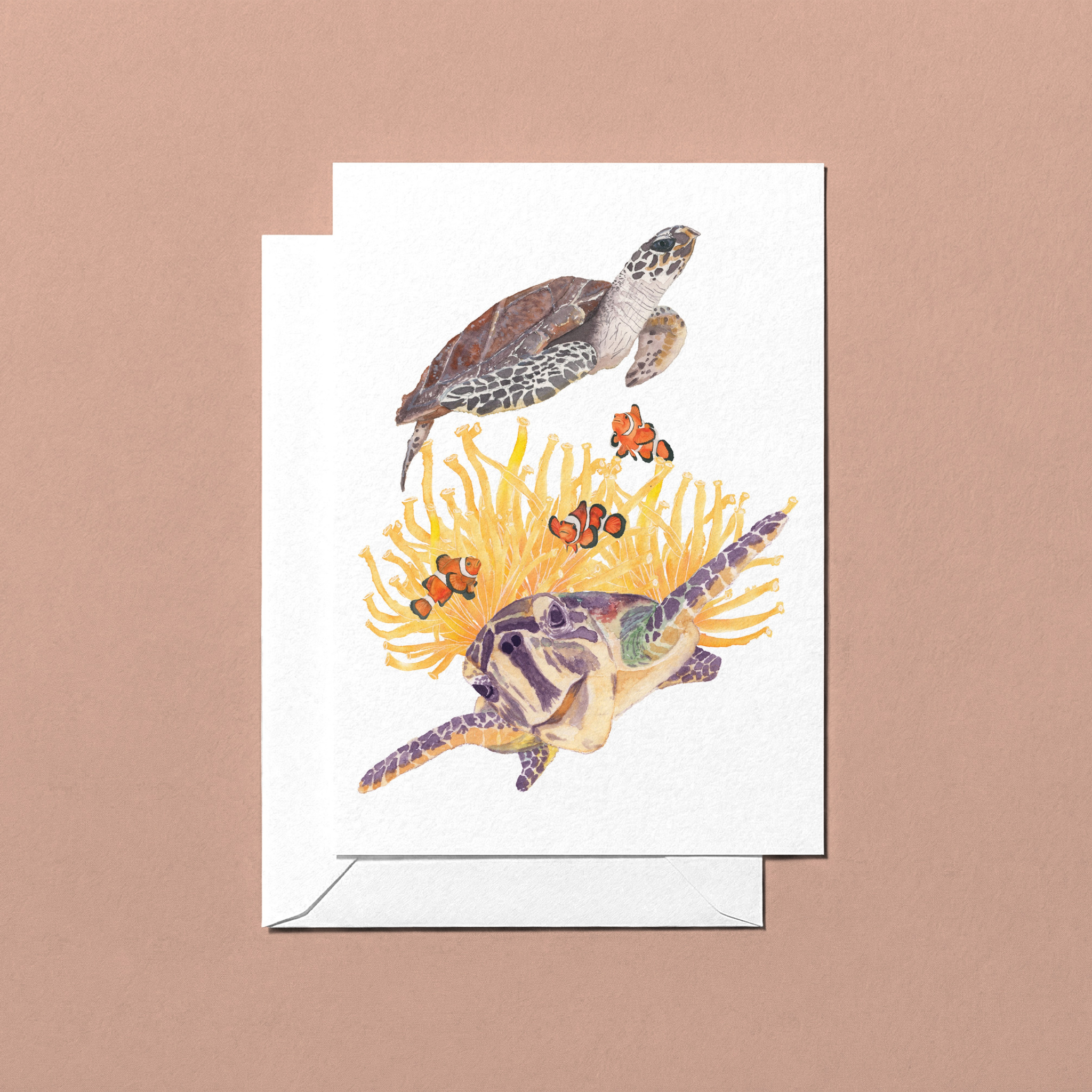 Greeting card with two watercolour hand-illustrated sea turtles swimming among coral 