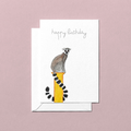Greeting card with a lemur watercolour illustration and 'happy birthday' text on a pink background