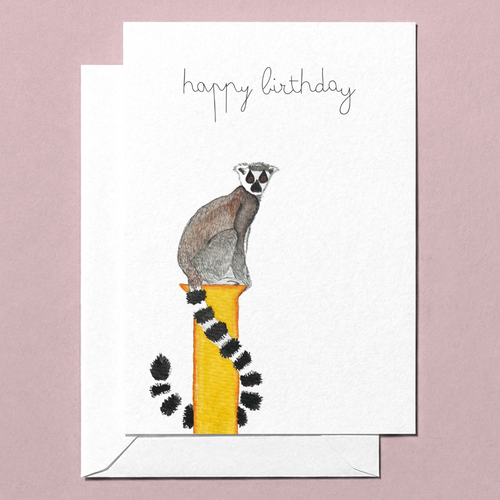 Greeting card with a lemur watercolour illustration and 'happy birthday' text on a pink background