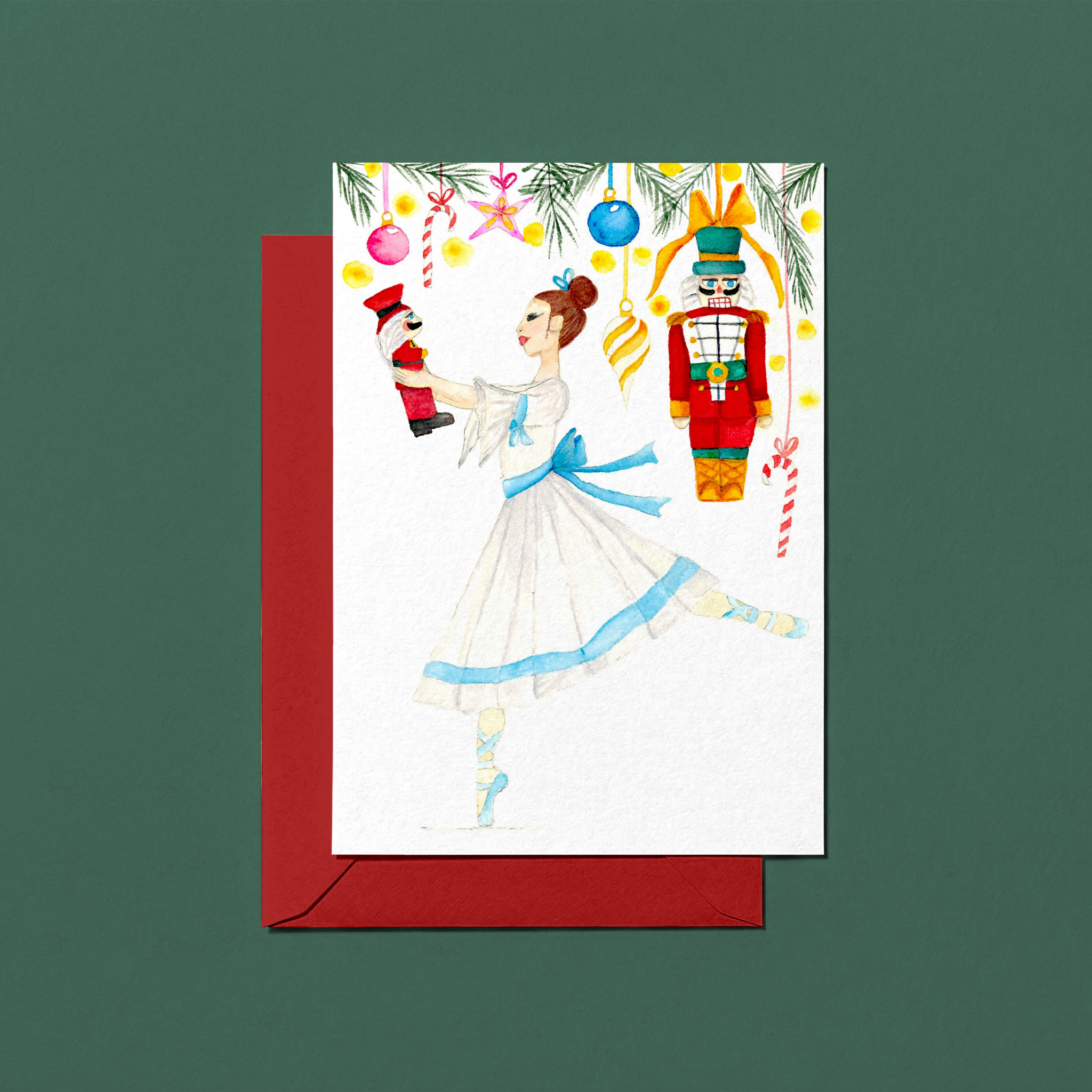 Christmas card with a watercolour hand-illustrated ballerina and nutcrackers design on a green background